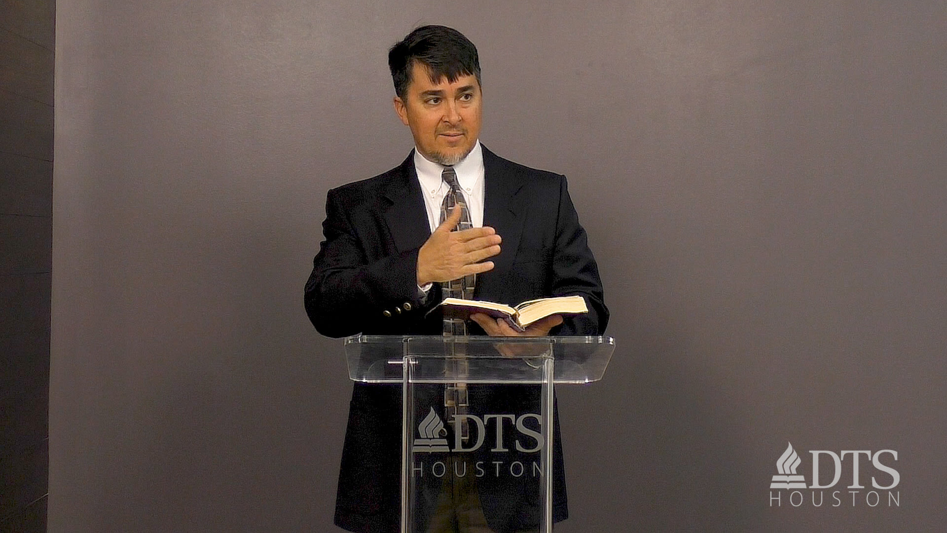 man standing at podium speaking at DTS Chapel