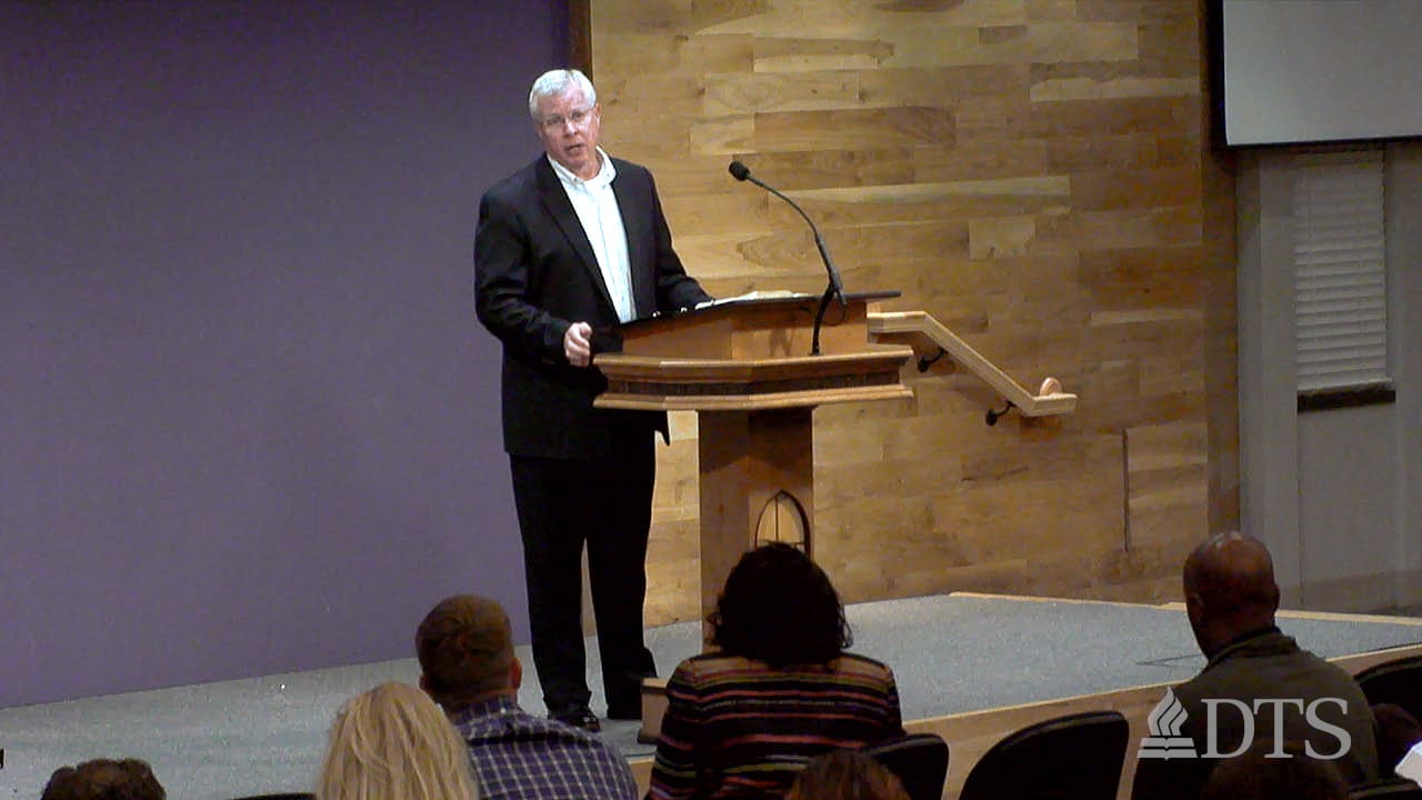 man standing at podium speaking at DTS Chapel