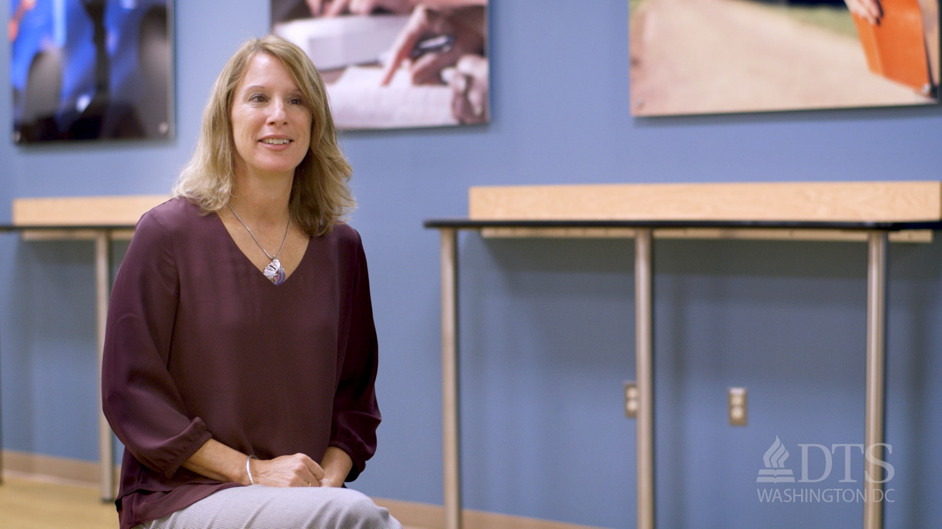 Amy Zacaroli seated and listening to someone out of view