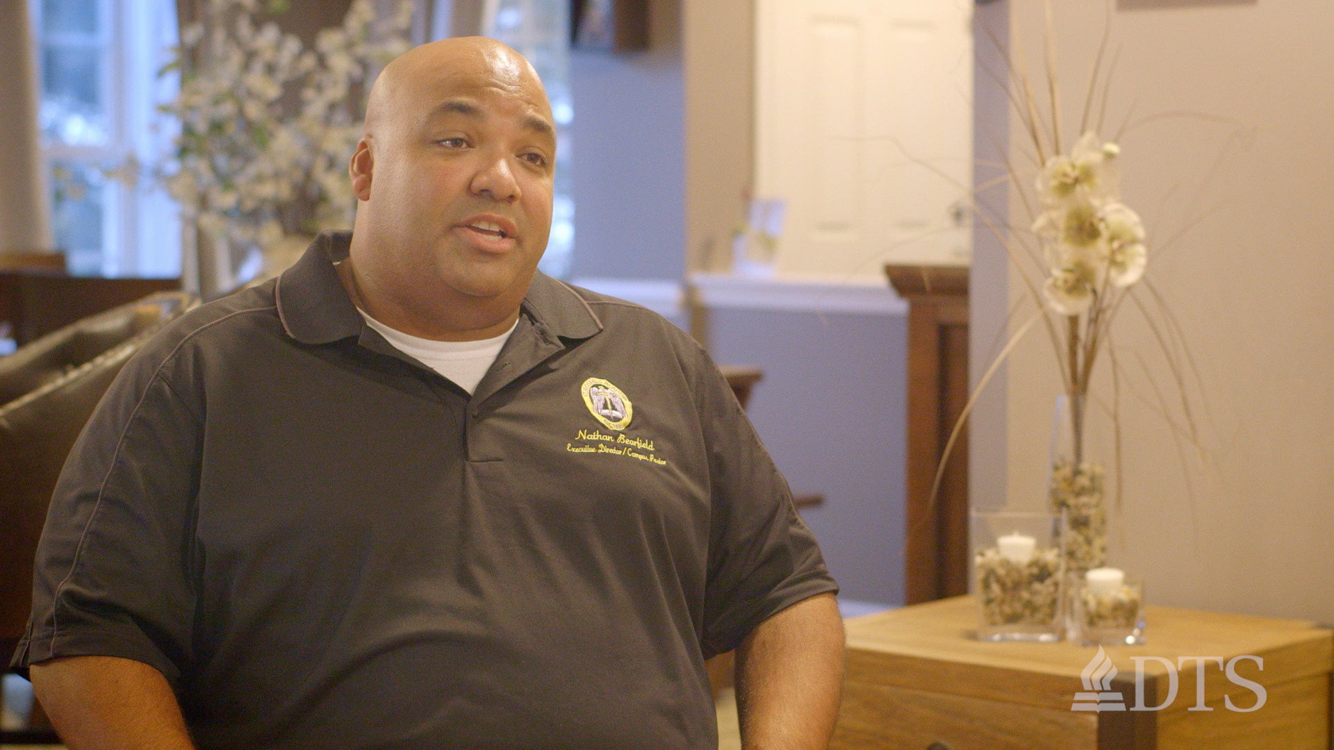 Nate Bearfield seated while speaking to someone out of view