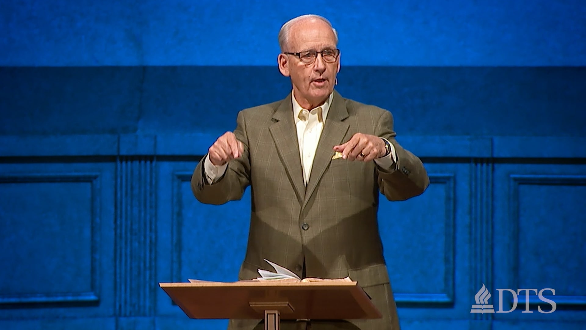 DTS alum Ted Kitchens speaks at a podium