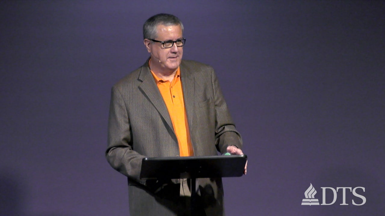 man standing at podium speaking at DTS Chapel