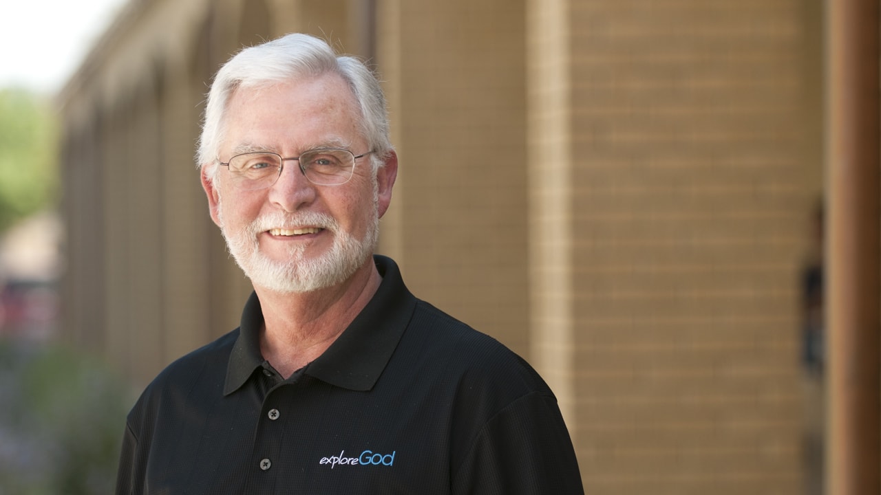 Dr. Waters smiling outside on DTS campus