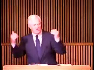 man standing at podium speaking at DTS Chapel