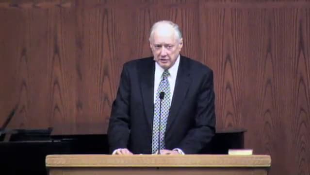 man standing at podium speaking at DTS Chapel