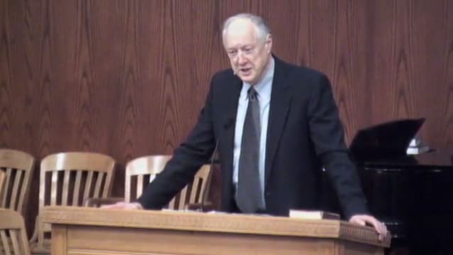 man standing at podium speaking at DTS Chapel