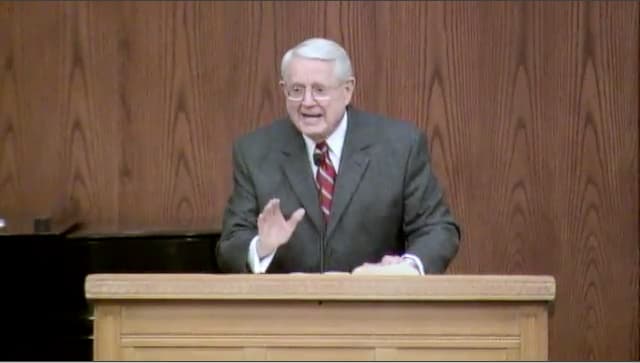 Dr. Chuck Swindoll standing at podium speaking at DTS Chapel