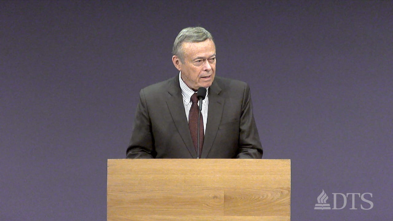 man standing at podium speaking at DTS Chapel