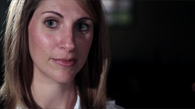 DTS alum Elizabeth Oates looking at someone out of view