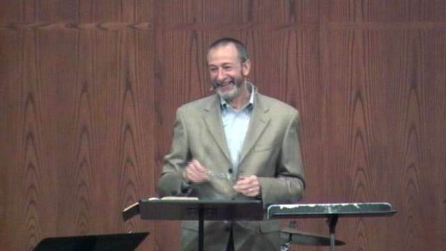 man standing at podium speaking at DTS Chapel