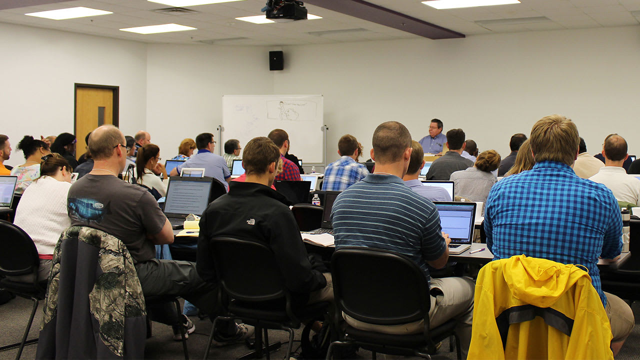 Dr. mark Bailey teaching in a DTS classroom full of students