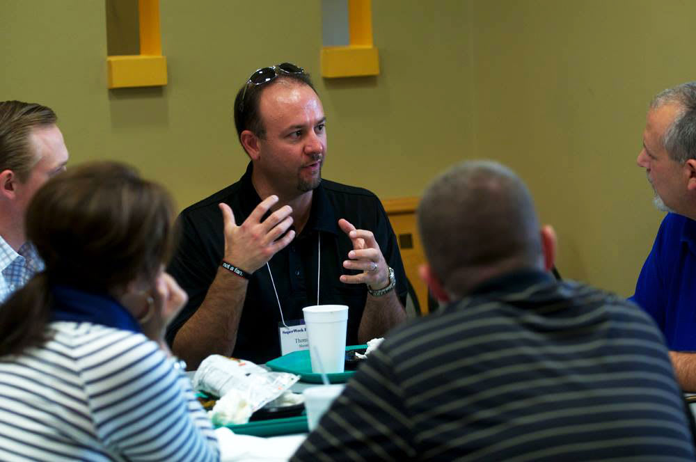 Dr. Kreider listening to a student during lunch