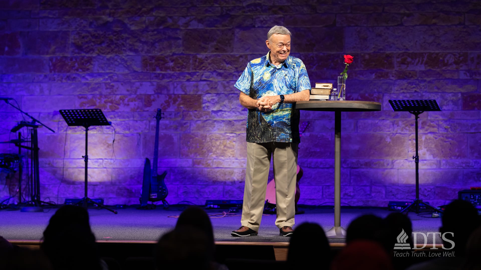 Dr Ron Allen speaking on stage of Chafer Chapel at Dallas Theological Seminary