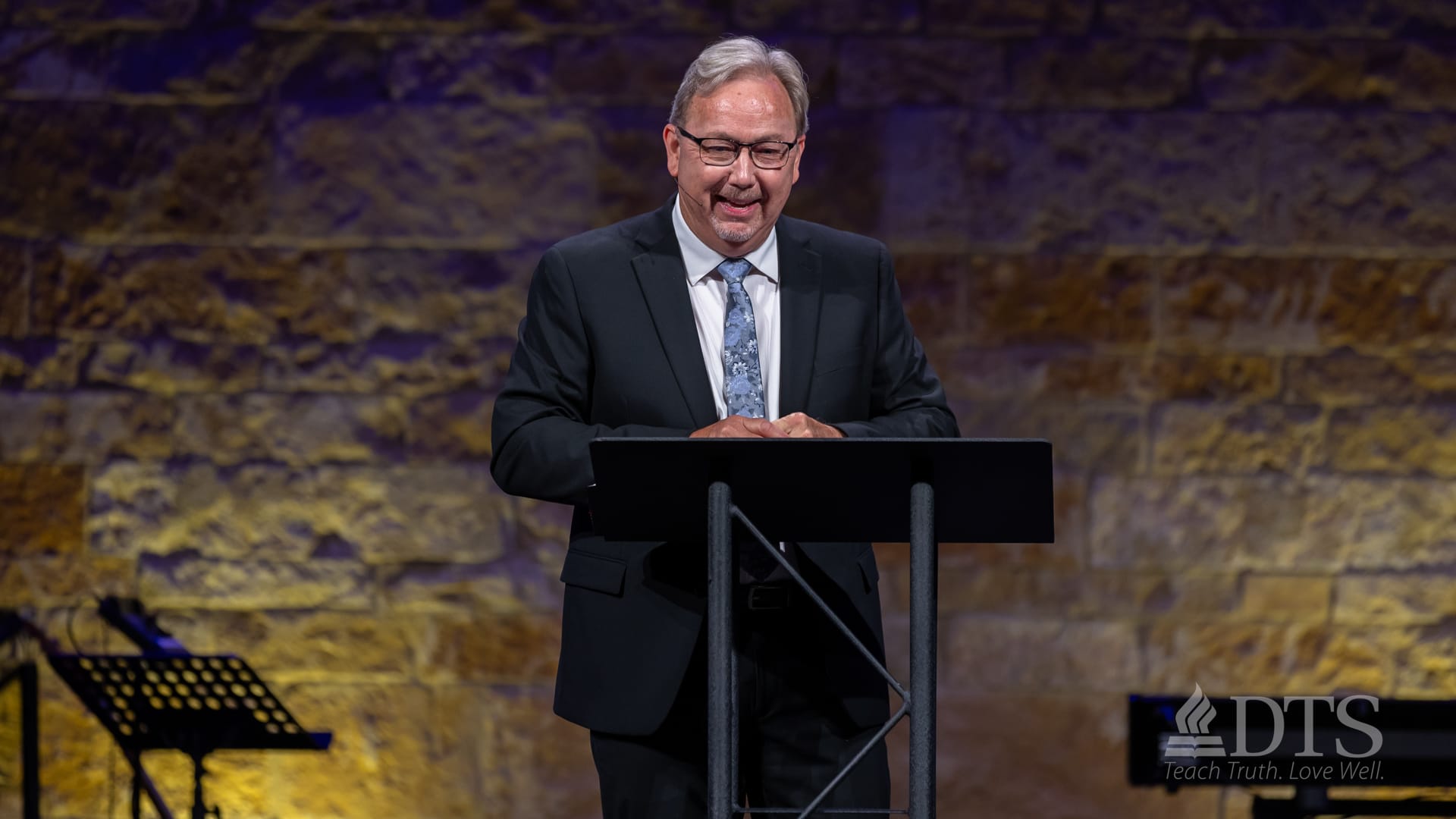 Marty Baker speaking from the stage at Dallas Seminary
