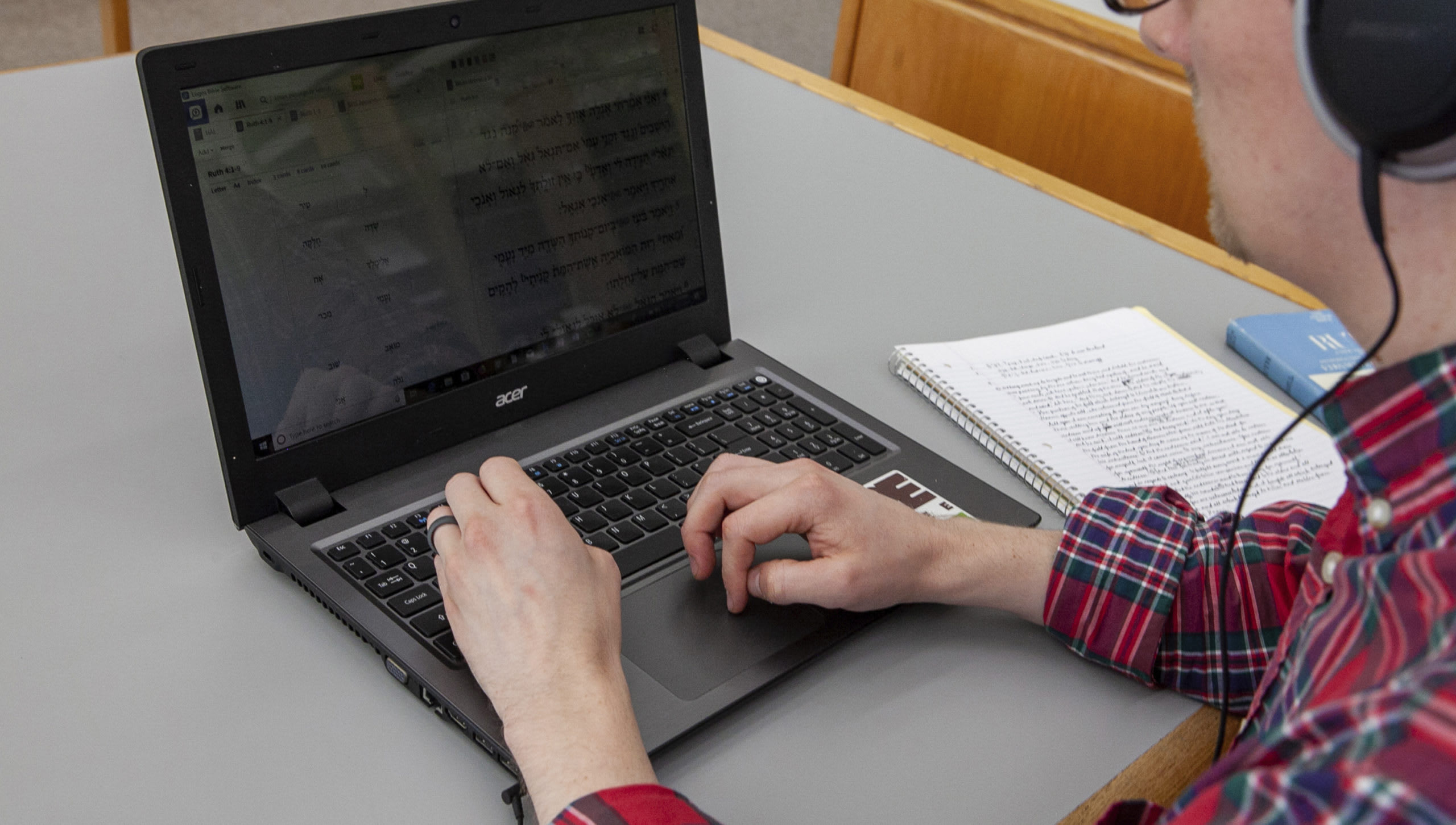 man sitting in front of his laptop