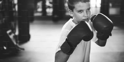 Teen learning boxing techniques