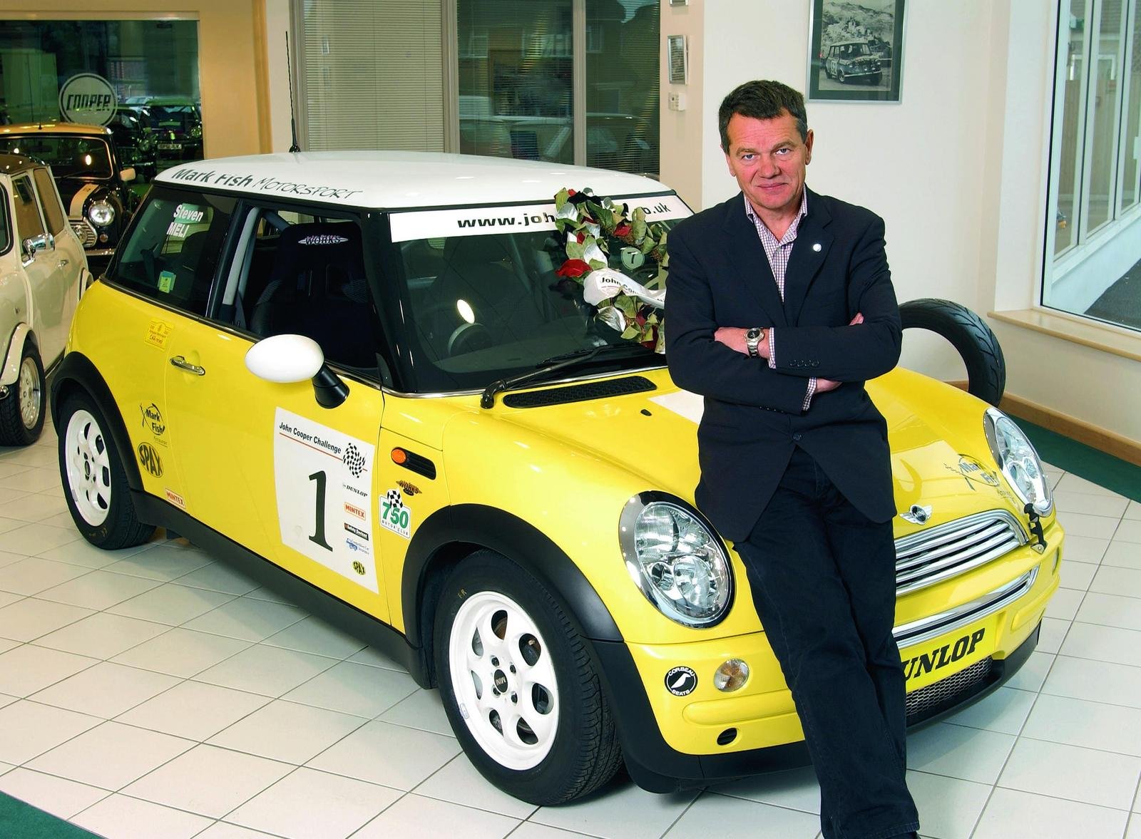 Michael Cooper sat on MINI Cooper Works R50 Yellow Car