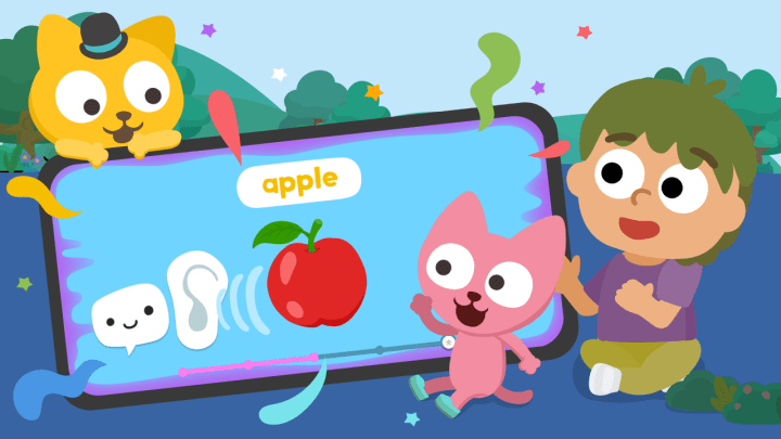 Happy kid using Studycat language app with speaking games