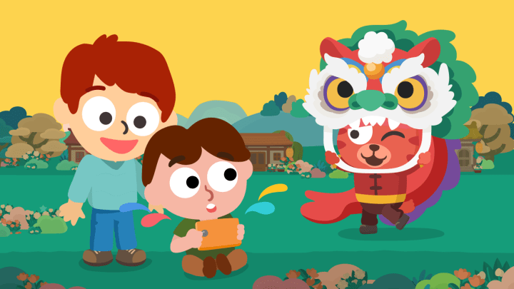 Young kids smiling while playing with Studycat Chinese language app on a tablet.