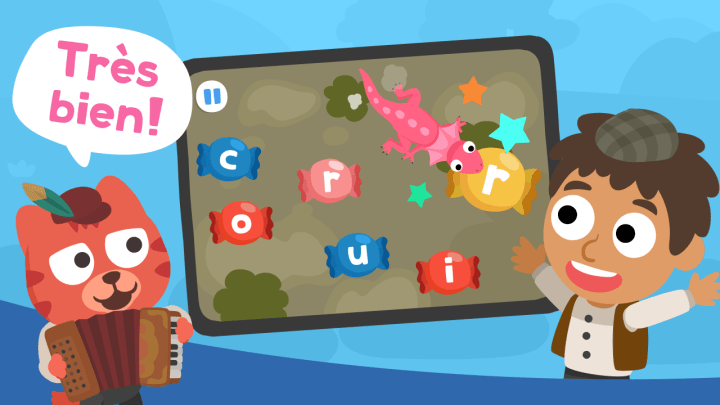 Happy boy playing Studycat French that keeps a happy kid engaged, beating traditional flashcards for early vocabulary learning.