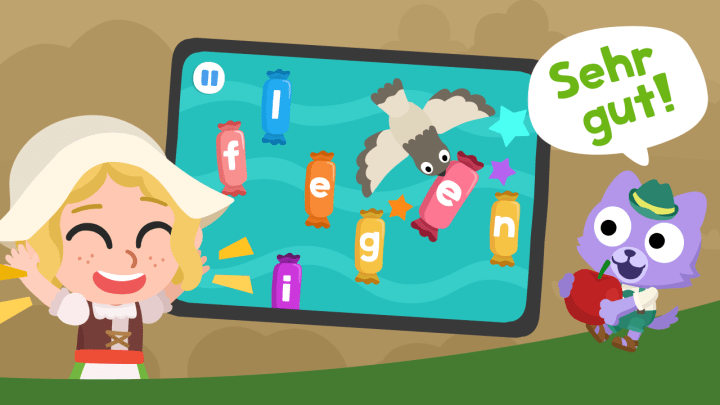 A happy child learning with the Studycat German language app on an Android device, proving how playful apps beat worksheet-first practice.