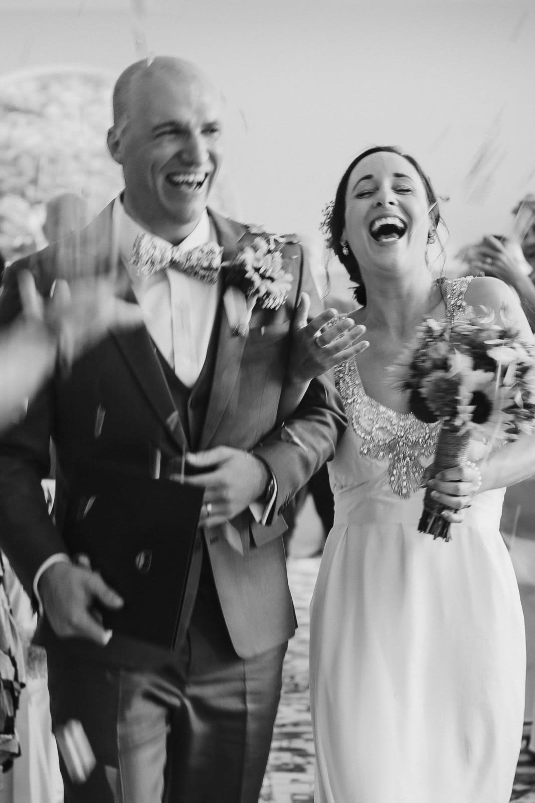 Black-and-white ceremony moment filled with laughter and joy.