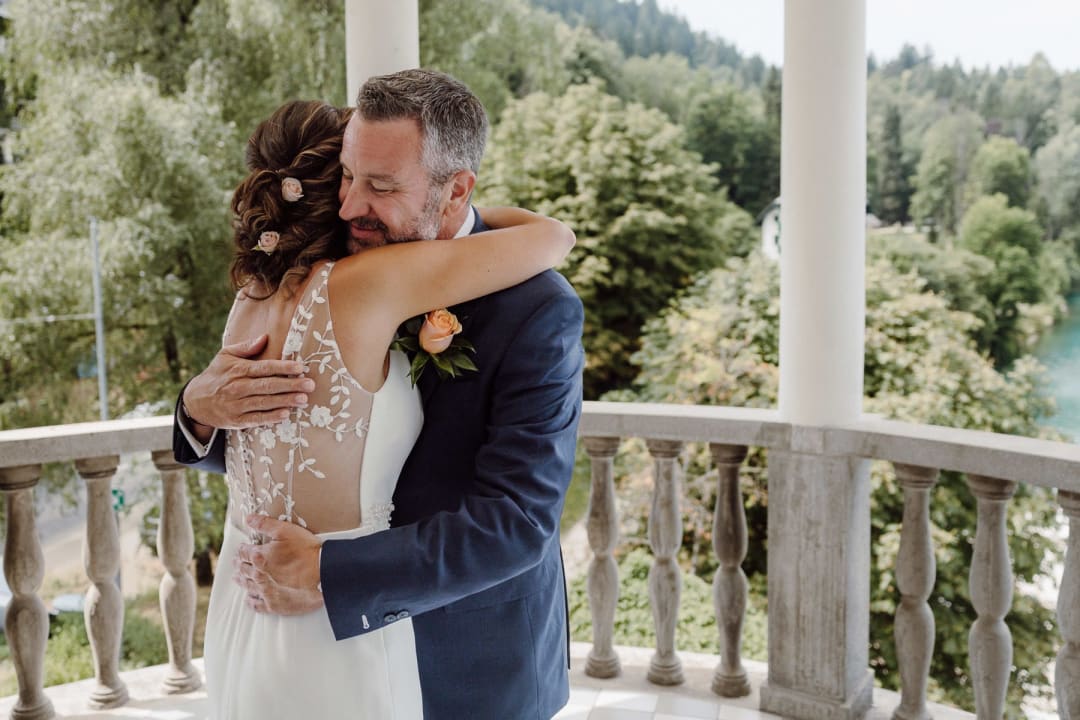 Couple embracing during their emotional first look.