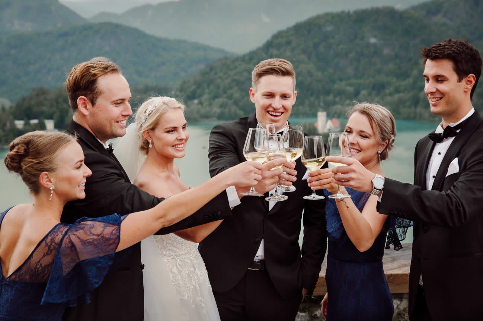 Wedding party toast with champagne, lively celebration energy.
