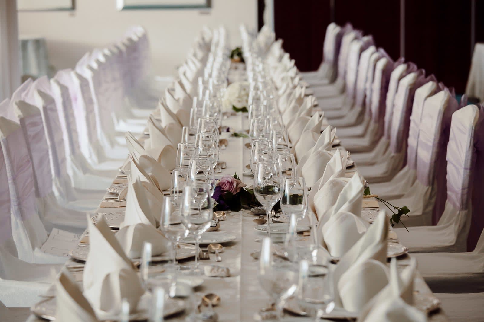 Elegant wedding reception table with fine linens and glassware at Grand Hotel Toplice, Lake Bled, photographed in a refined editorial style.