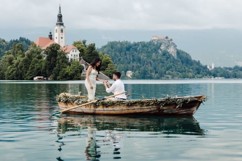 Romantic boat proposal with Bled Island visible in the background.