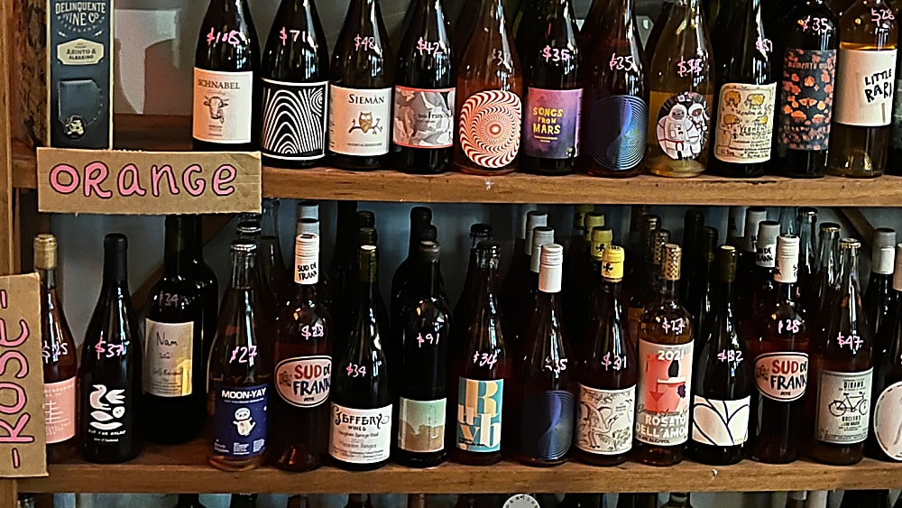 Picture of table with selection of cheese, fruit, crackers and sweet wine