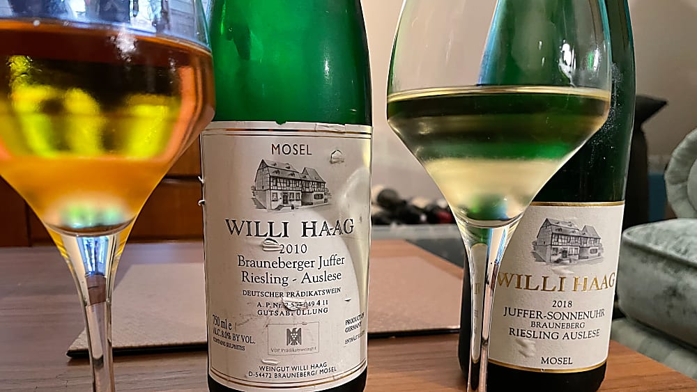 two bottles of Riesling wine and glasses two bottles of Riesling wine and glasses