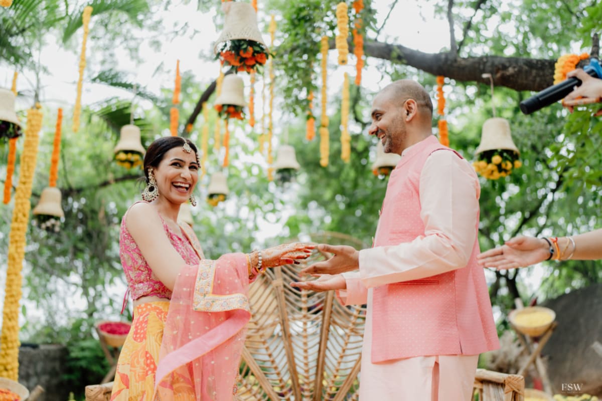 cinematic wedding reception frame in  Taj Krishna ,hyderabad by FineShot Weddings