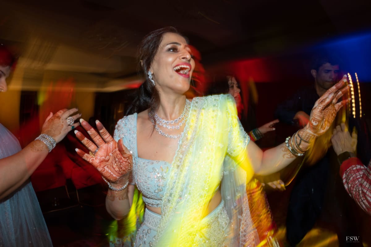 cinematic wedding reception frame in  Taj Krishna ,hyderabad by FineShot Weddings