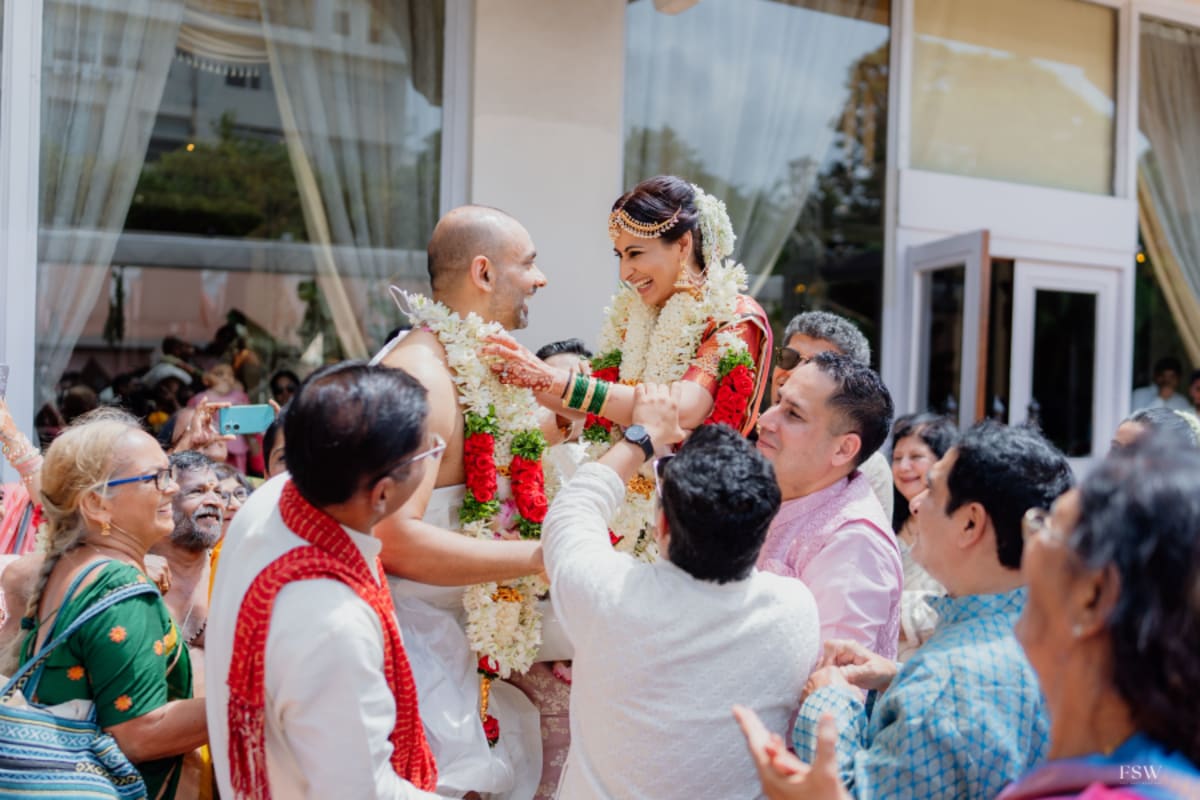 cinematic wedding reception frame in  Taj Krishna ,hyderabad by FineShot Weddings