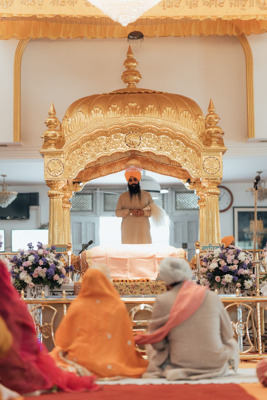 Groom and family during Anand Karaj ceremony at Gurdwara Pune — cinematic documentary wedding film by FineShot Weddings