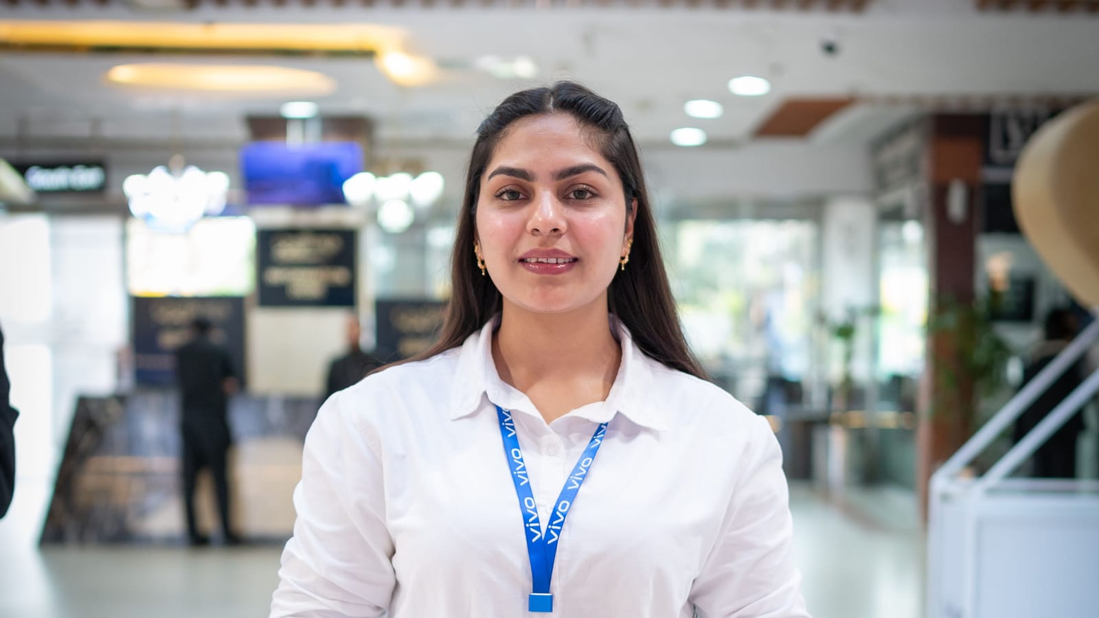 A sales assistant at a mobile phone shop in Islamabad