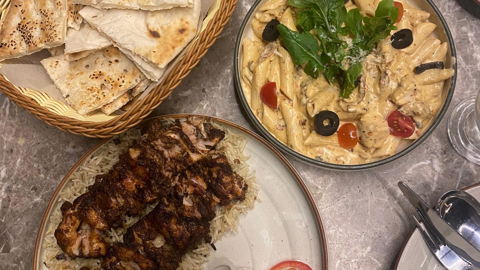 A spread of Pakistani dishes with naan and barbecue in Karachi