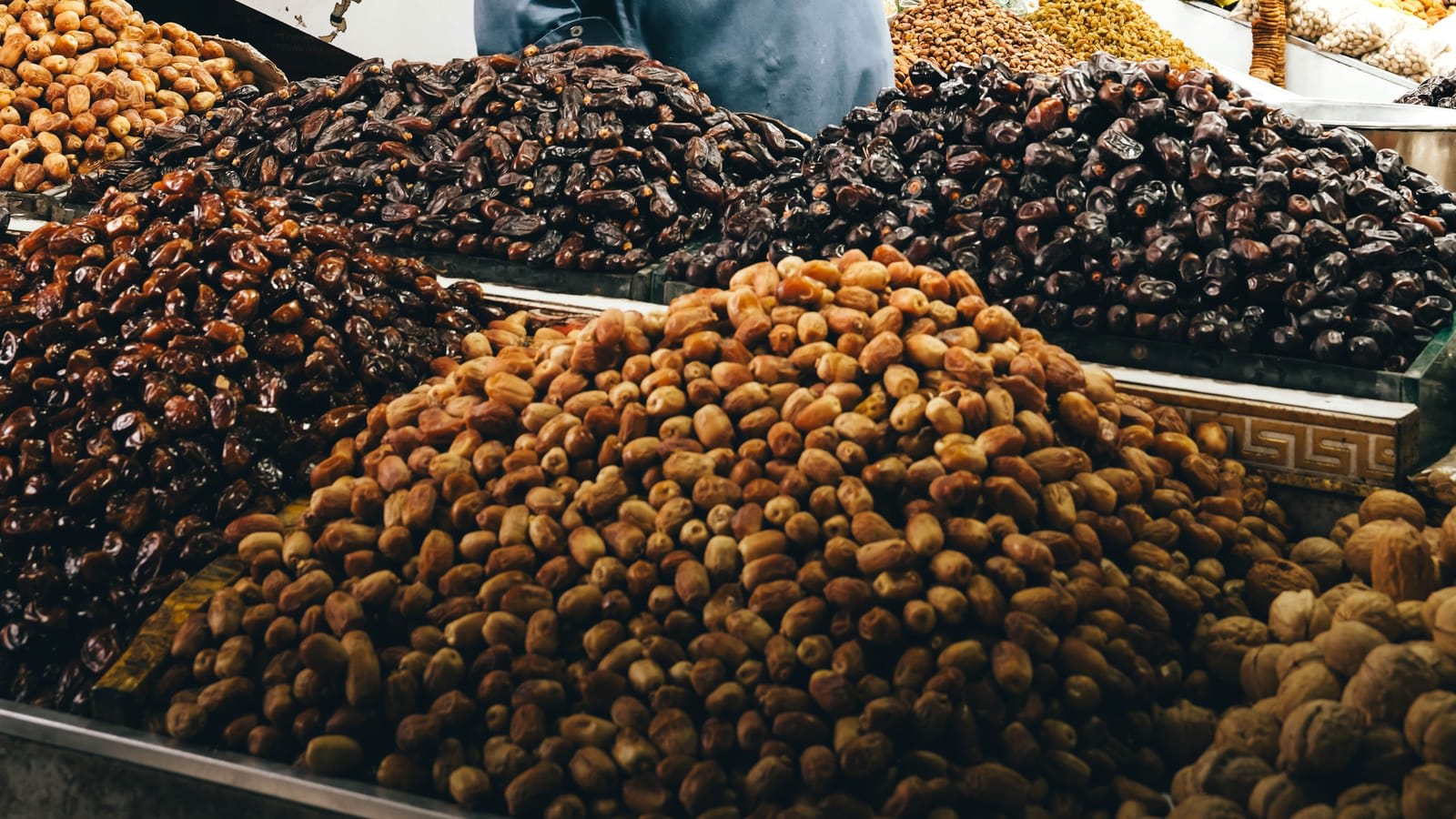 Dates and dried fruit piled high at a market stall in Karachi