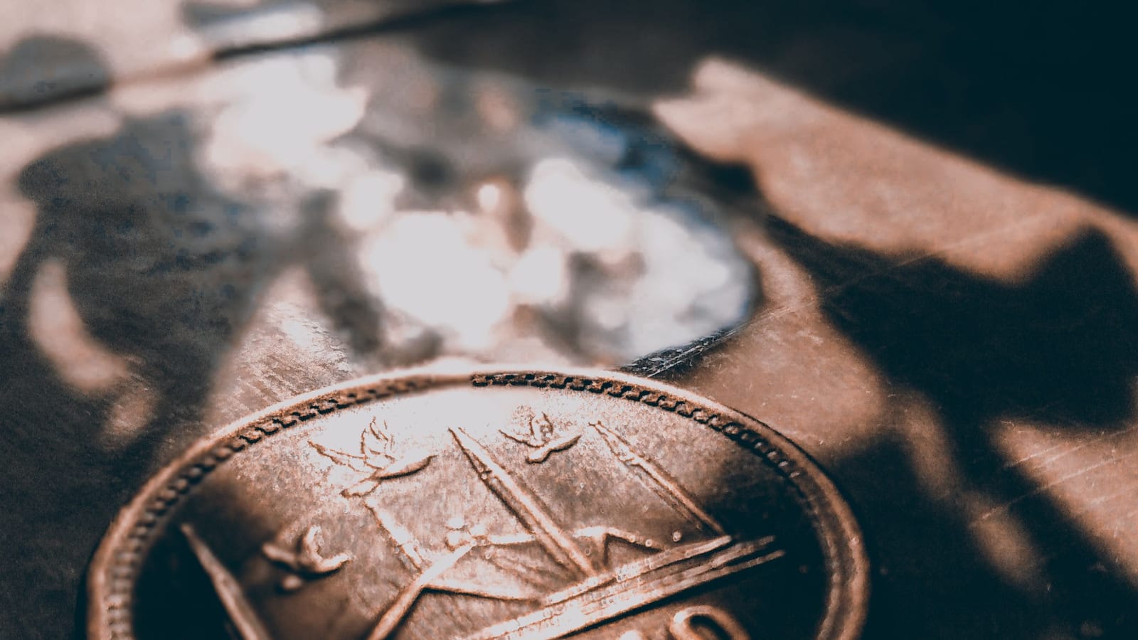 A Pakistani ten-rupee coin lit by sunlight