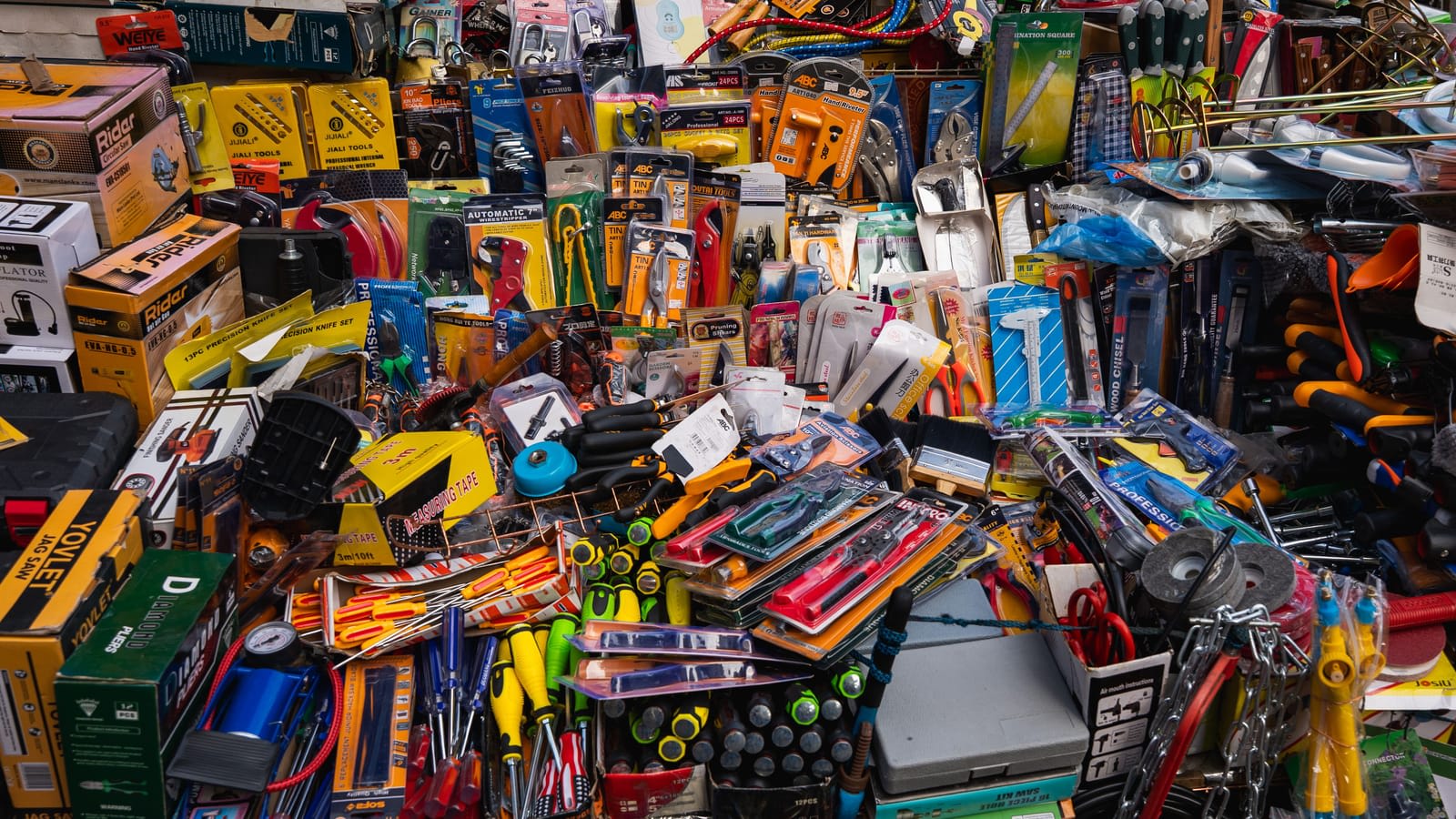 Hundreds of tools and hardware items on display at a market shop