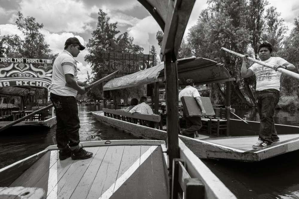 Trajinera boats at Xochimilco crowd the canals.