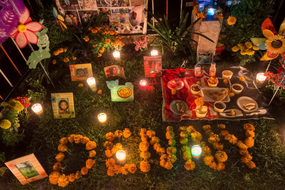 An altar at a grave for a seven-year-old boy on the night of November 1. 