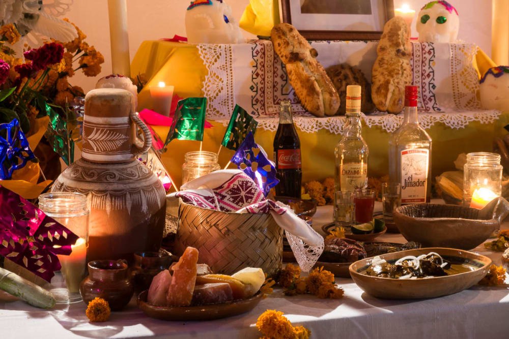Alcohol and other offerings on a Day of the Dead altar in Ixtlahuacán de los Membrillos, Jalisco.