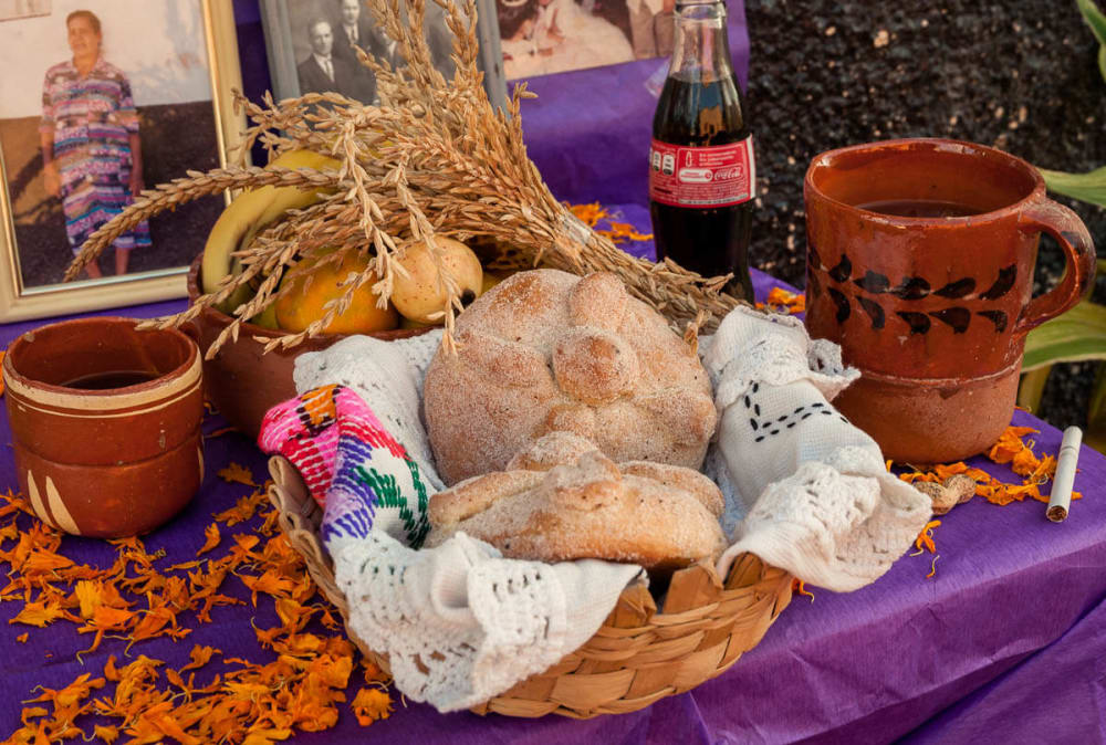 Pan de Muertos on a day of the dead altar on the Day of the Dead in Ajijic, Jalisco, Mexico