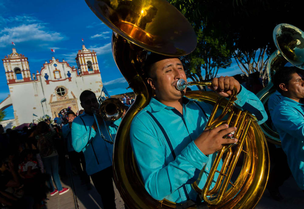 Banda playing in procession for Fiesta de la Sangre Preciosa del Cristo in Teotitlán del Valle, Oaxaca, Mexico.