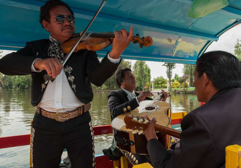 Mariachi musicians playing music at Xochimilco.