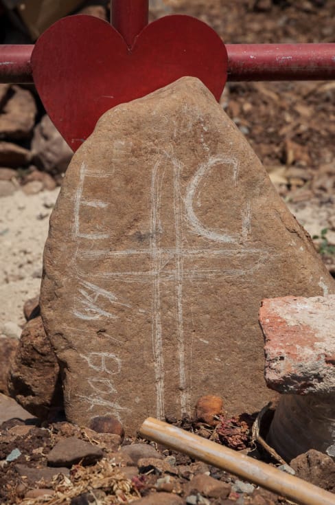 Hand-scratched initials and date on a headstone in the Mezcala, Jalisco, graveyard.