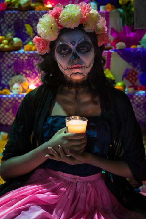 A catrina holds a candle on the noche de muertos in Chapala, Jalisco.