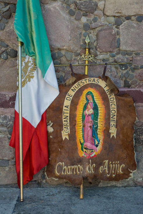 The Mexican flag and a banner for the charros of Ajijic.